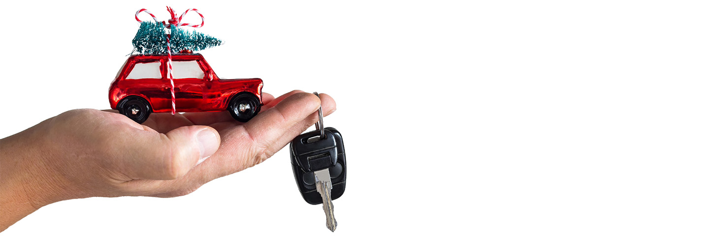 Hand Holding Keys with Red Truck