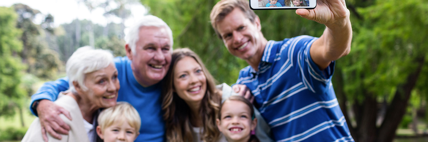 Family taking photo with cellphone